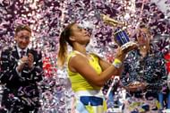 Aryna Sabalenka celebrates with the trophy at the Qatar Total Open 2020
